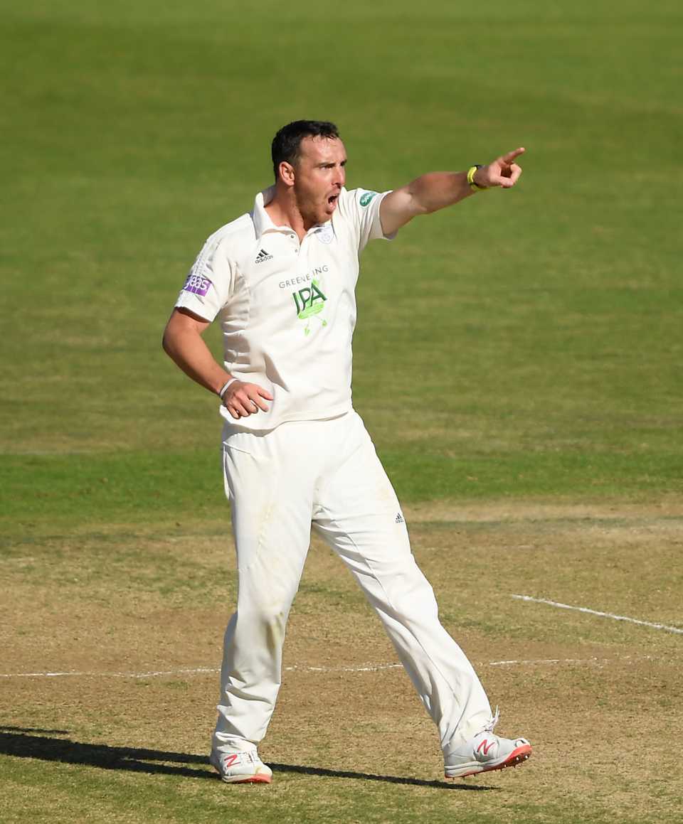 Kyle Abbott celebrates the wicket of Craig Overton