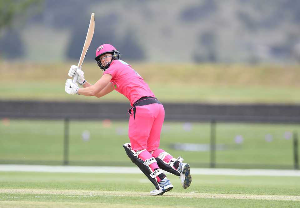 Ellyse Perry flicks the ball away