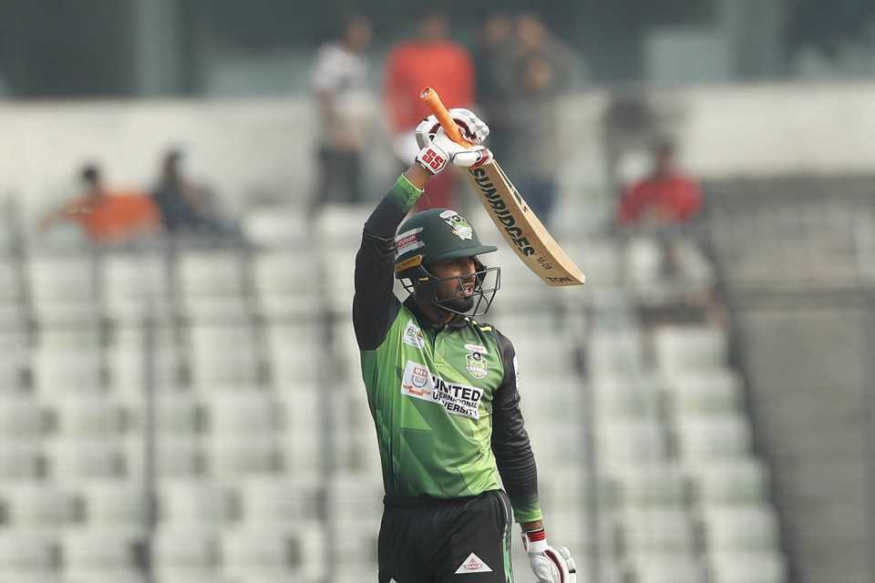 Mohammad Mithun raises his bat