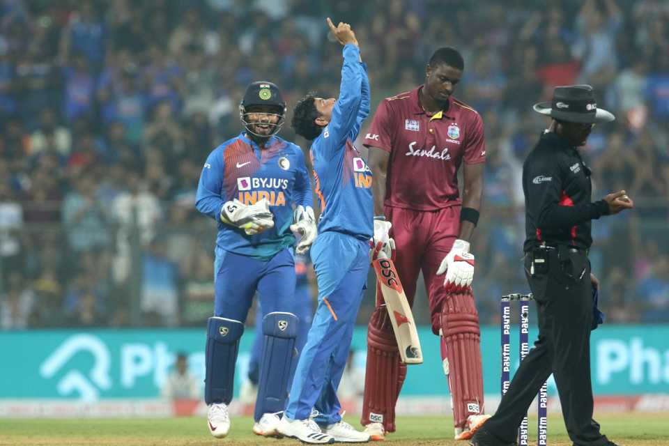Kuldeep Yadav and Rishabh Pant celebrate Jason Holder's wicket, India v West Indies, 3rd T20I, Mumbai, December 11, 2019