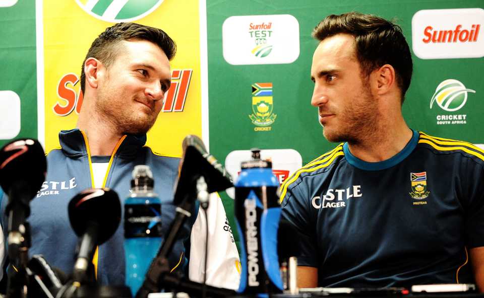 Graeme Smith and Faf du Plessis talk to each other at a press conference