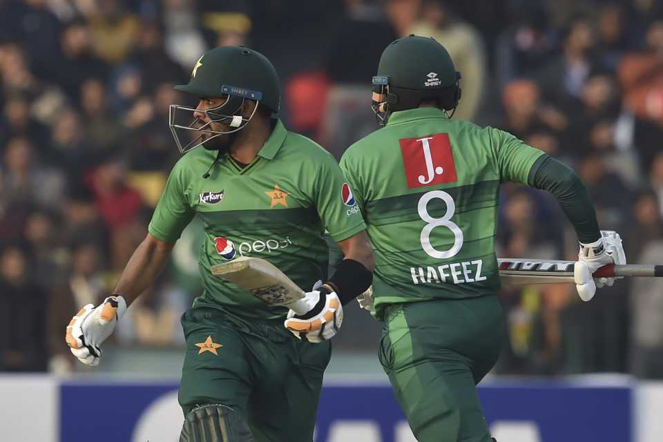 Babar Azam and Mohammad Hafeez take a run during their stand