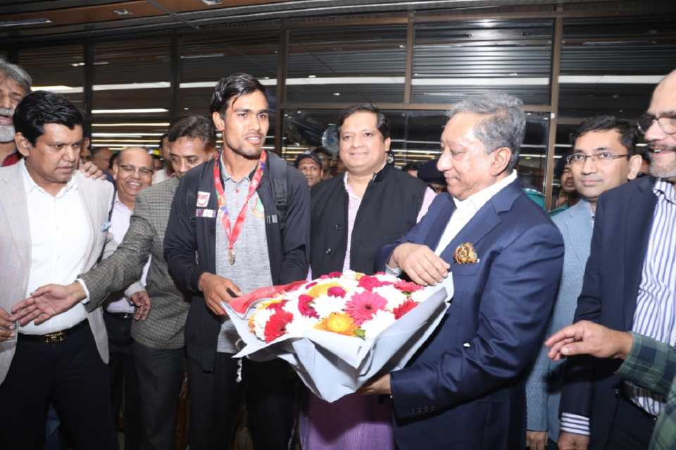 Bangladesh Under-19 World Cup-winning captain Akbar Ali is greeted by Nazmul Hasan