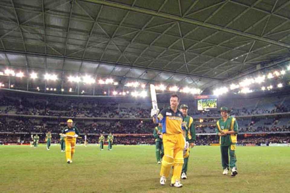 16 Aug 2000: Steve Waugh of Australia leaves the field at the end of the Australian innings after scoring 114 not out, in the match between Australia and South Africa, in game one of the Super Challenge 2000, played at Colonial Stadium in Melbourne, Australia. This is the first game of cricket to be played indoors.