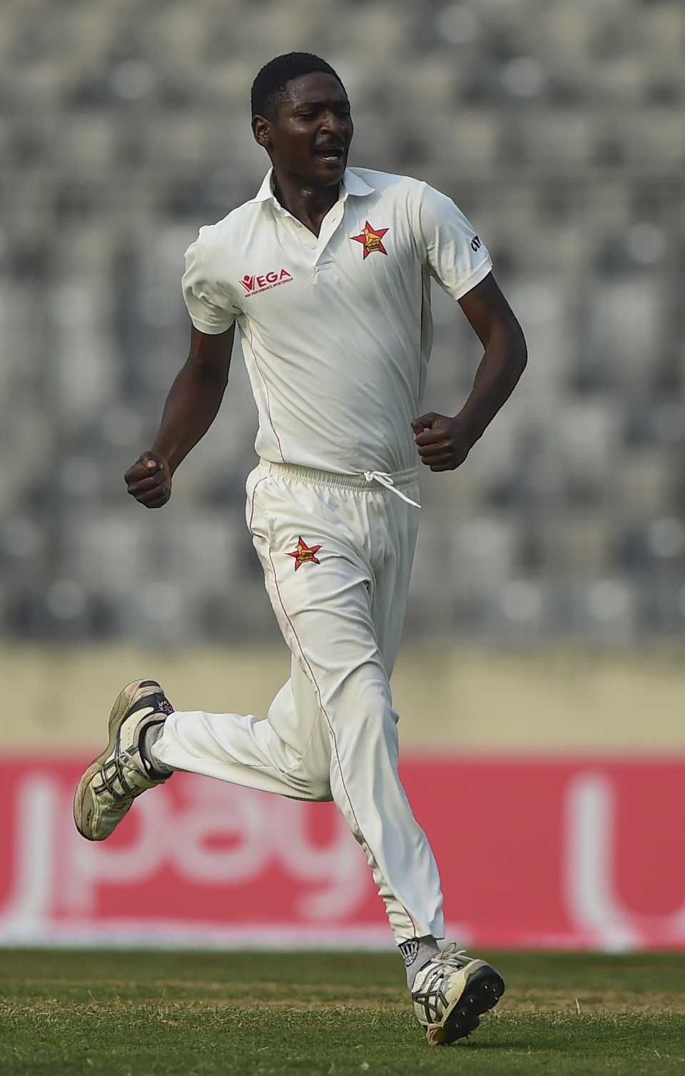 Charlton Tshuma is pumped after picking up his first Test wicket