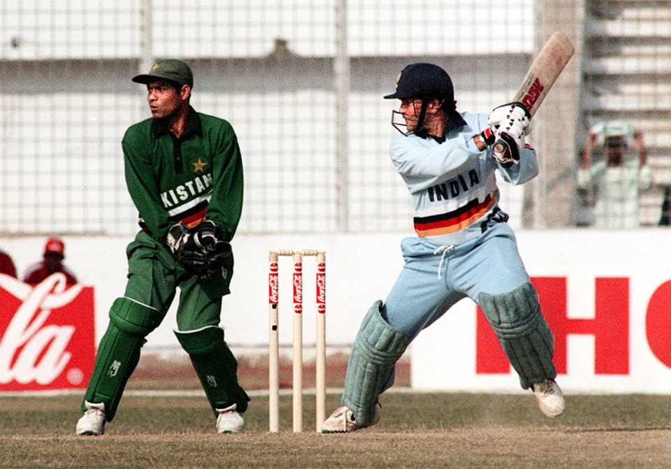 Wicketkeeper Rashid Latif watches Sachin Tendulkar cut his way to 95