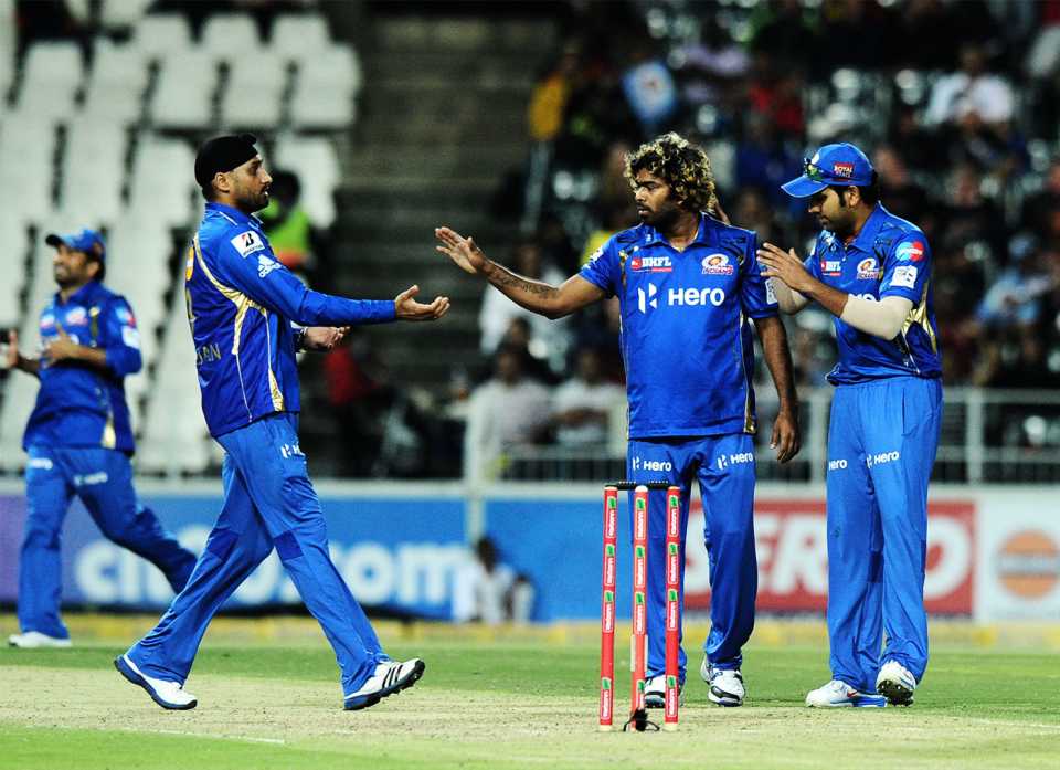 Lasith Malinga celebrates a wicket with Harbhajan Singh and Rohit Sharma