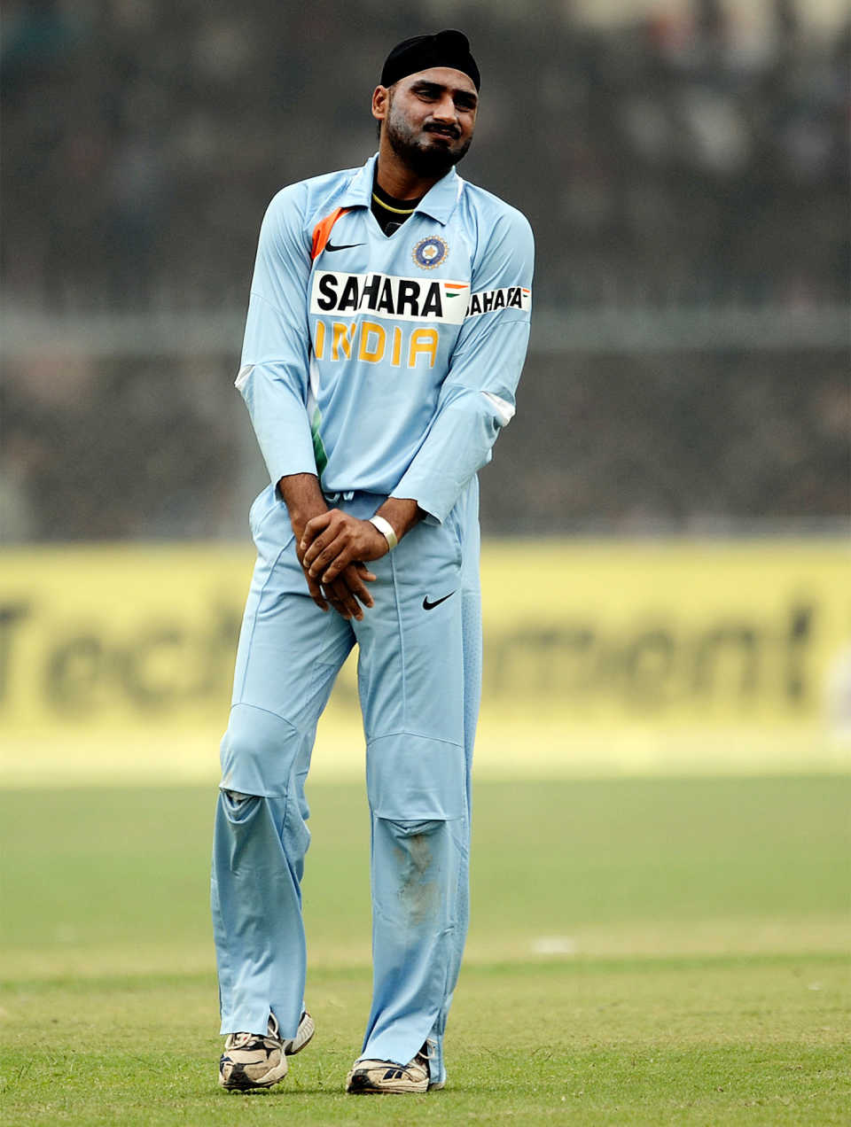 Harbhajan Singh grimaces and holds his fingers