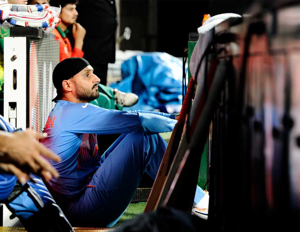 Harbhajan Singh watches the match from the boundary line