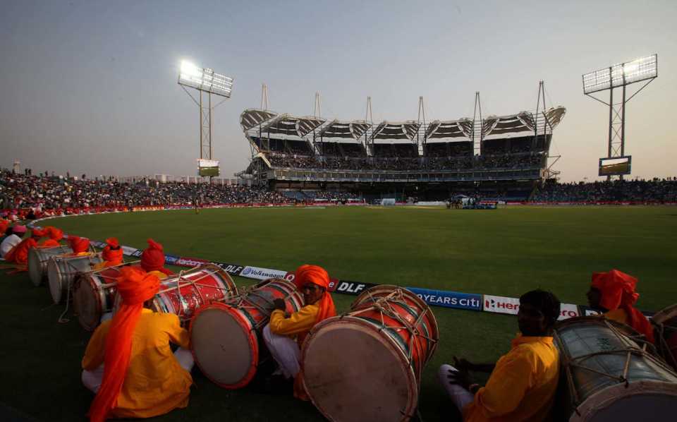 A drum crew waits to perform at the inauguration of the MCA stadium and its first IPL match