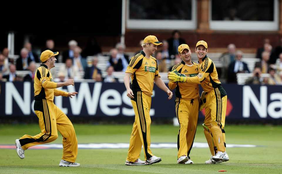 Michael Hussey, Cameron White, Michael Clarke and Tim Paine celebrate a wicket