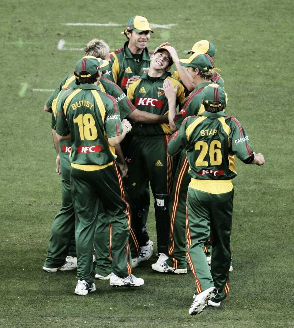 Tim Paine celebrates a wicket with his team-mates
