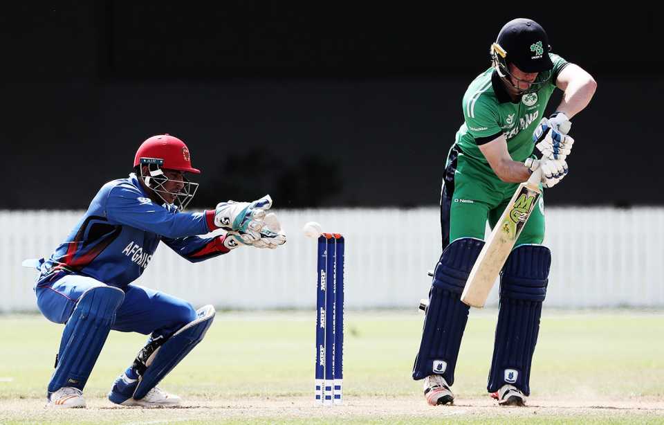 Jamie Grassi looks to defend a ball while Rahmanullah Gurbaz waits behind the wicket