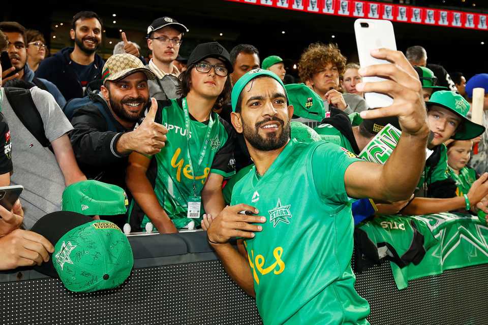 Haris Rauf takes a photo with fans