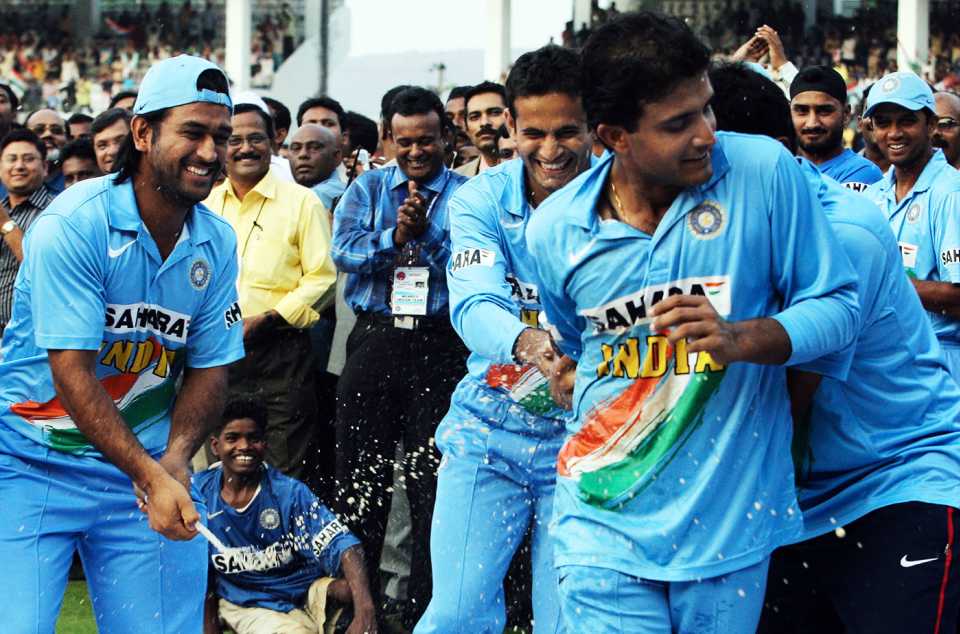 MS Dhoni sprays champagne on a fleeing Sourav Ganguly
