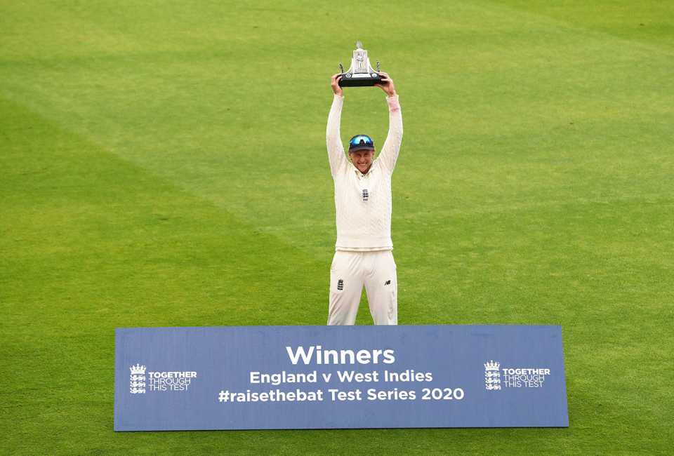 Joe Root lifts the Wisden Trophy and braves the rain at Old Trafford, England v West Indies, Third Test, Day 5, Emirates Old Trafford, July 28, 2020