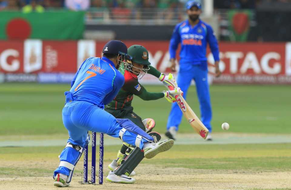 MS Dhoni tries to stop a Mushfiqur Rahim shot with his leg, India v Bangladesh, super four stage, Asia Cup 2018, Dubai, September 21, 2018