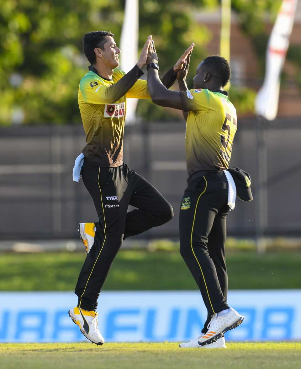 Mujeeb Ur Rahman and Rovman Powell celebrate a wicket, Barbados Tridents v Jamaica Tallawahs, CPL 2020, Port of Spain, August 26, 2020