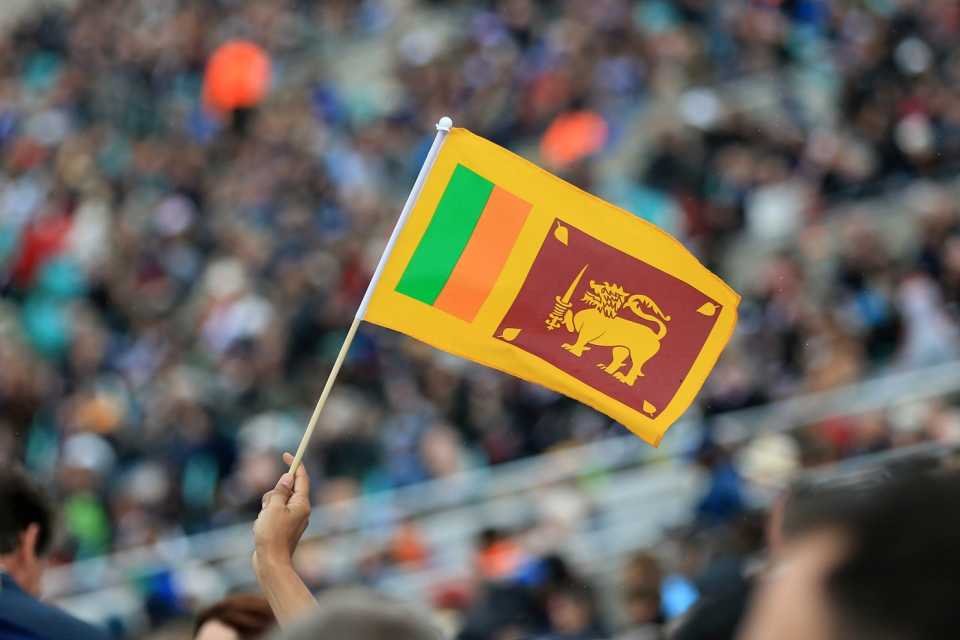A fan holds up a Sri Lanka flag