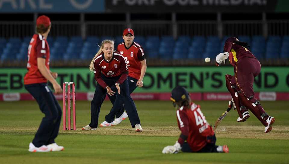 England's fielders attempt a run-out against West Indies