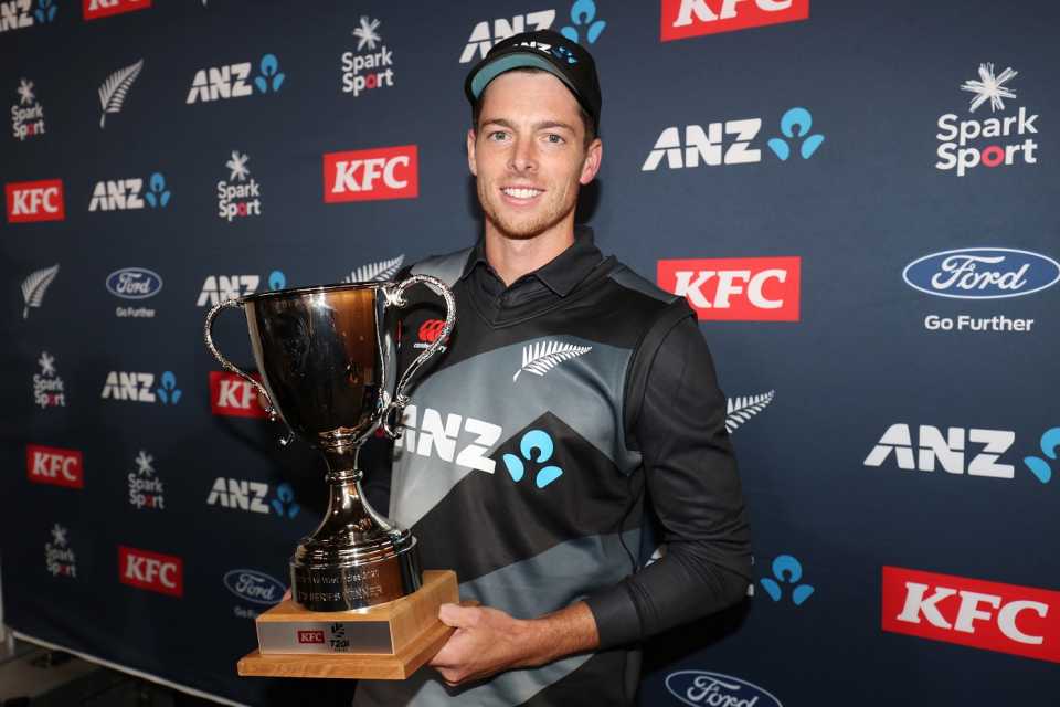 Mitchell Santner poses with the series trophy