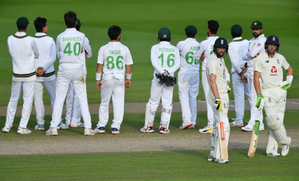 Jos Buttler and Chris Woakes await the review of Buttler's wicket, England v Pakistan, 1st Test, Old Trafford, 4th day, August 8, 2020