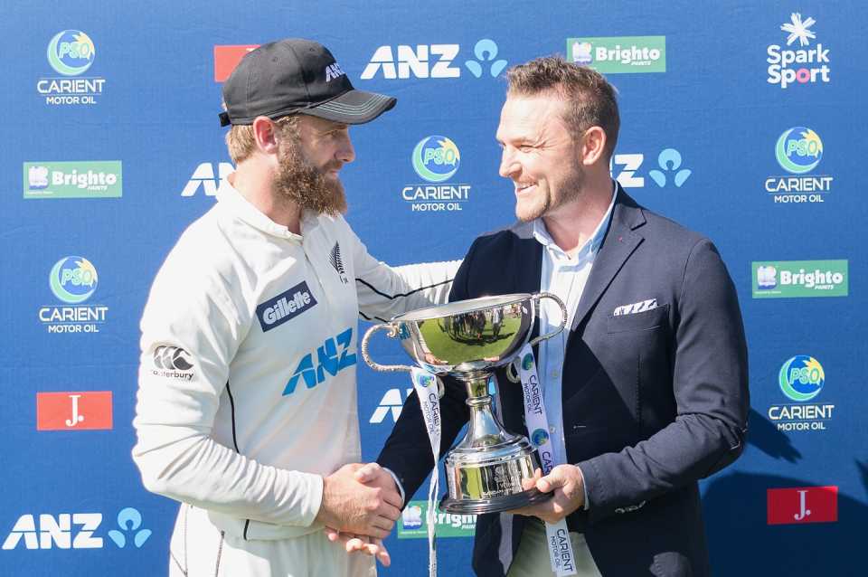 Kane Williamson receives the trophy from his predecessor, Brendon McCullum
