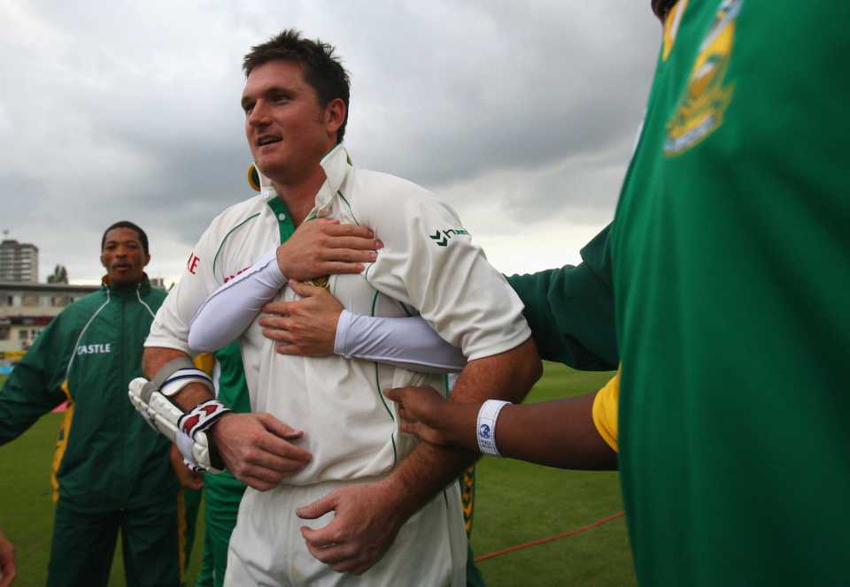 Graeme Smith is hugged by team-mates