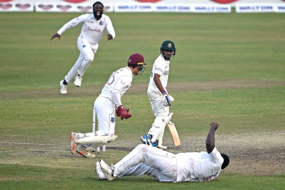 Mehidy Hasan Miraz looks on as Rahkeem Cornwall completes a diving catch in the slips to hand West Indies victory