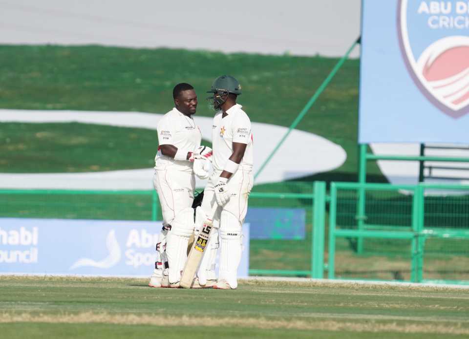 Prince Masvaure and Kevin Kasuza after hitting the winning runs, Afghanistan vs Zimbabwe, 1st Test, Abu Dhabi, 2nd day, March 3, 2021