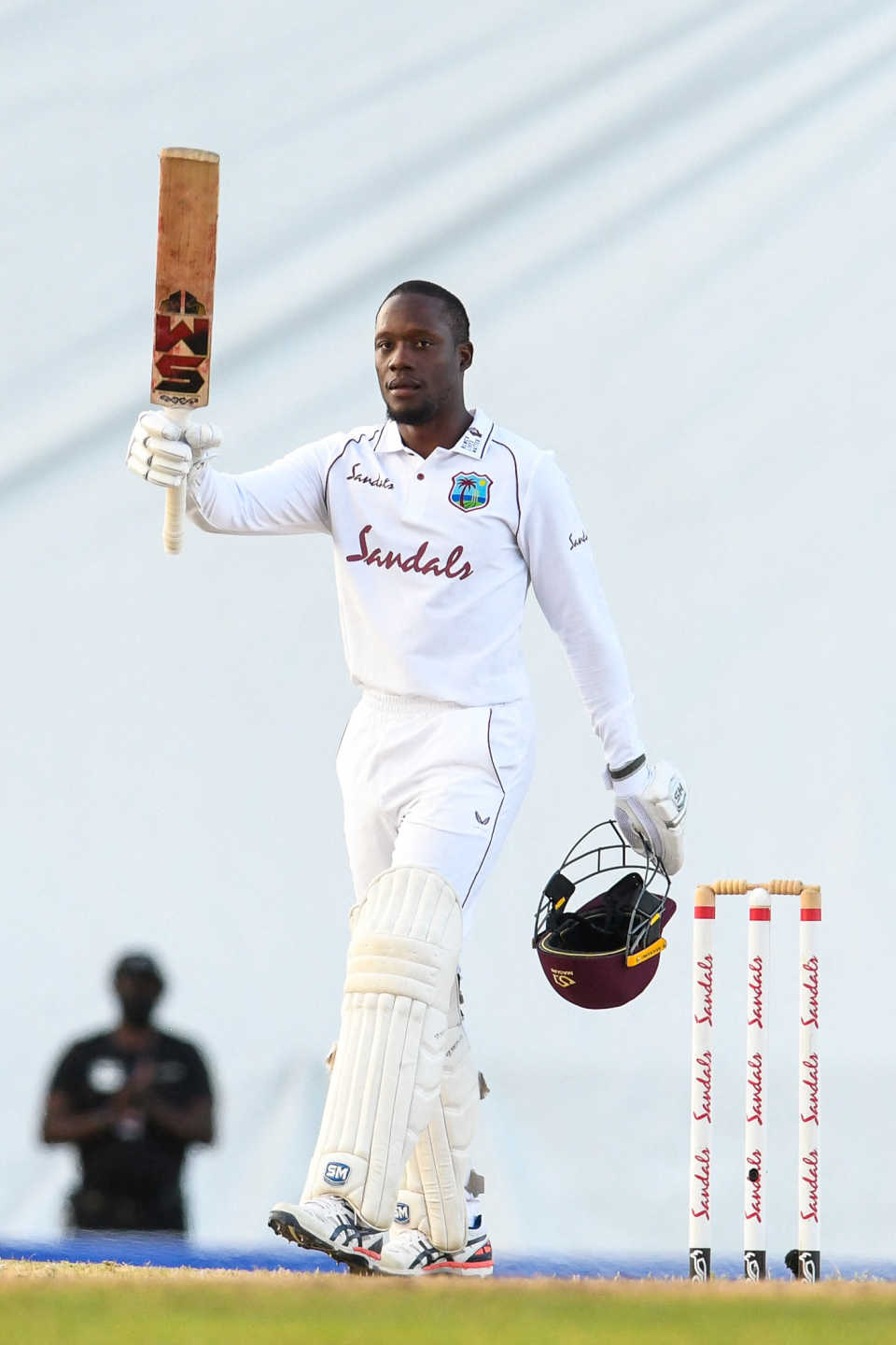 Nkrumah Bonner raises his bat after reaching his maiden Test century