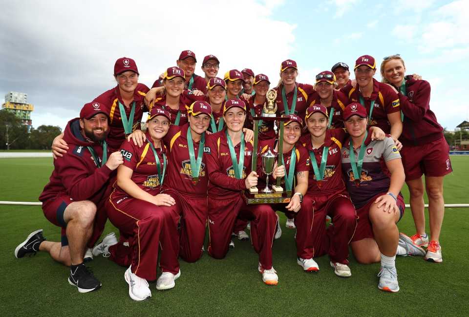 History made: First-time champions Queensland pose with the Ruth Preddy Cup - the trophy awarded to the winners of the WNCL, the domestic 50-over competition