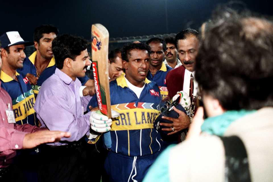 Aravinda de Silva tries to make his way out of the ground after the victory