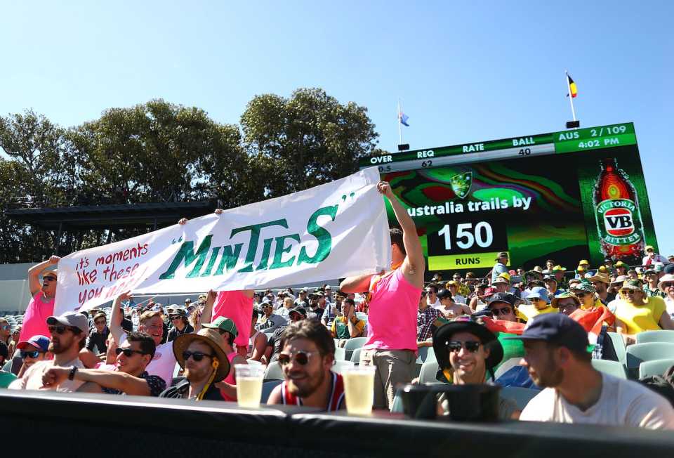 A Minties sign is displayed in the crowd towards Faf du Plessis
