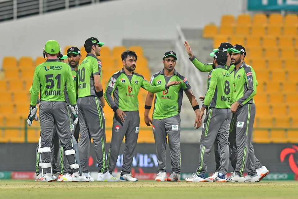 Rashid Khan celebrates with team-mates after taking a wicket, Islamabad United vs Lahore Qalandars, Abu Dhabi, PSL 2021, June 9, 2021