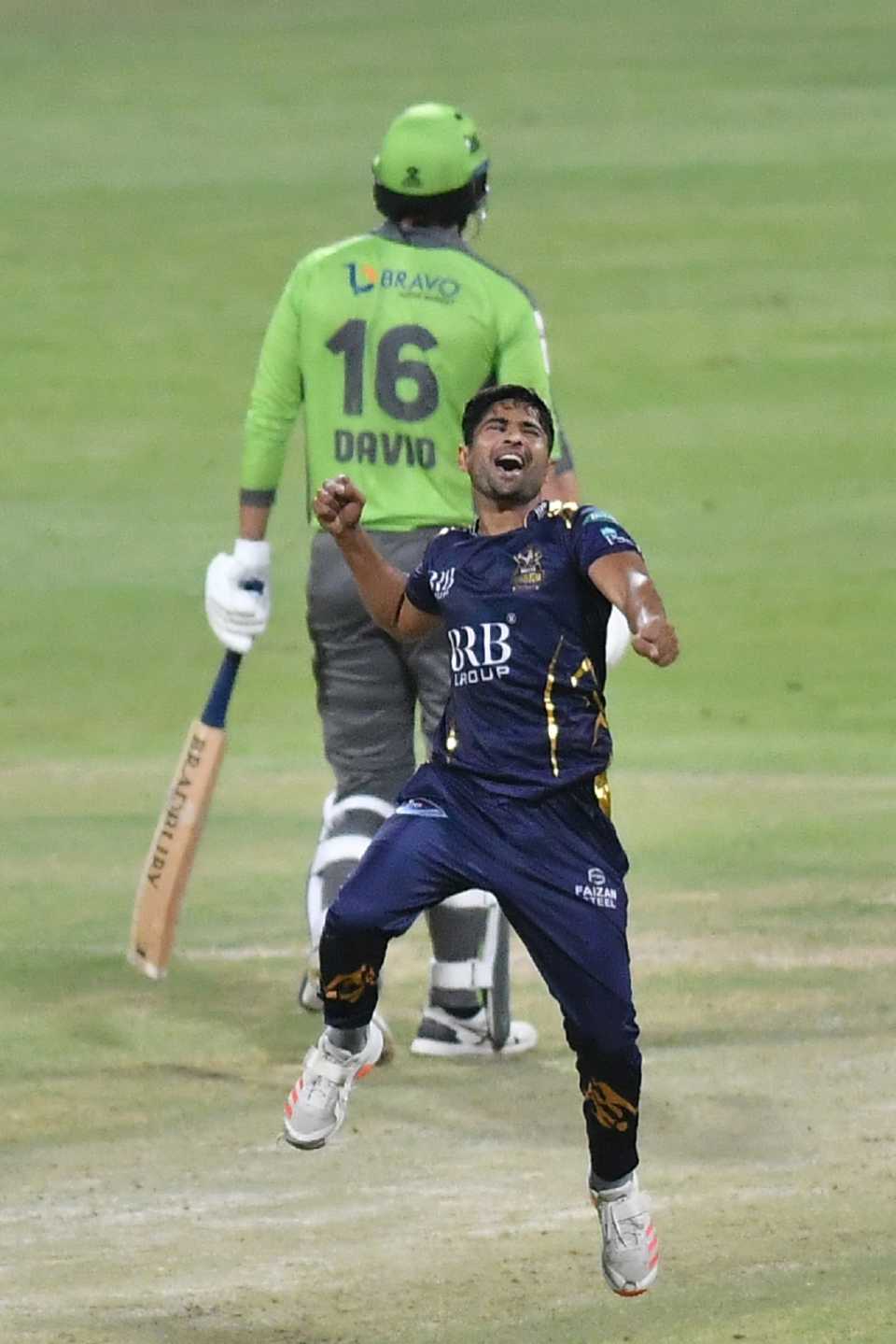 Khurram Shahzad leaps to celebrate a wicket