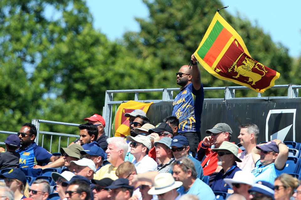 A fan waves a Sri Lanka flag in the crowd at the Riverside