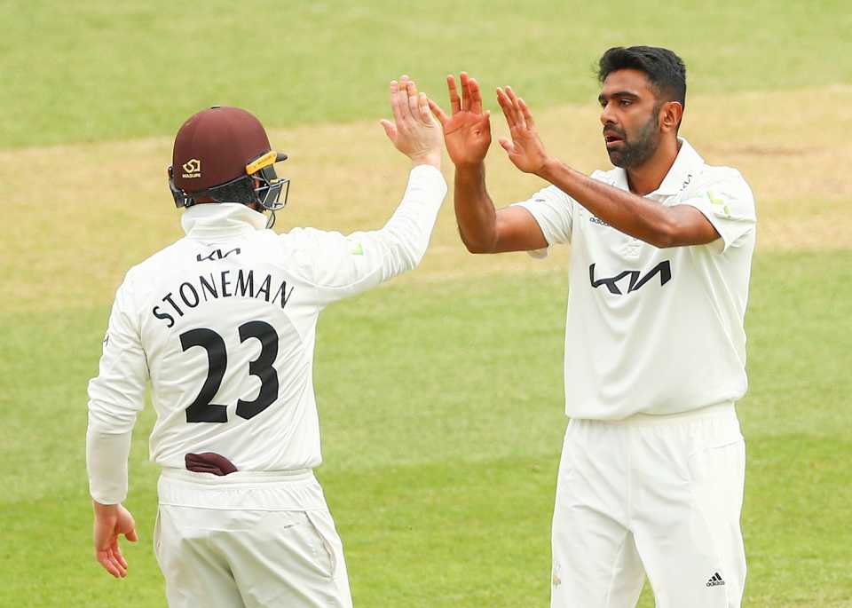 R Ashwin of Surrey celebrates a Somerset wicket with Mark Stoneman, The Oval, London, July 14, 2021