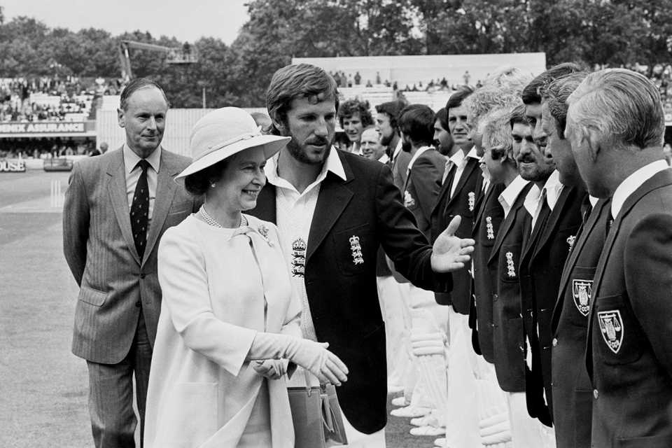 England captain Ian Botham introduces his team to Queen Elizabeth while MCC president Peter May looks on