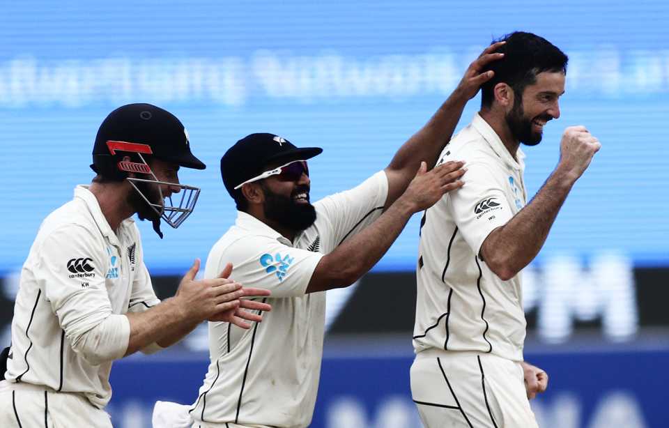 Kane Williamson, Ajaz Patel and William Somerville celebrate a wicket