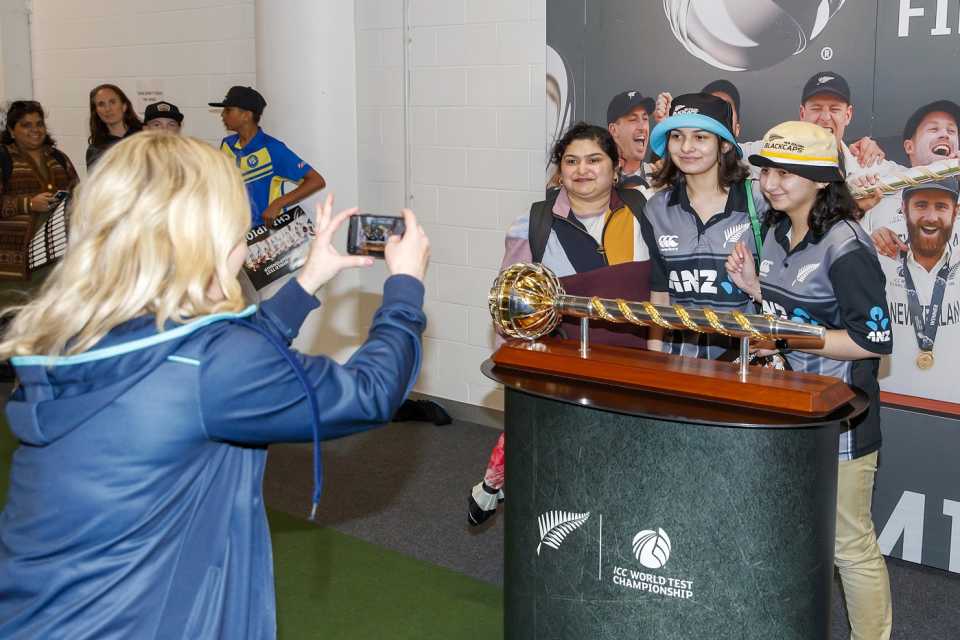 New Zealand fans pose with the mace in Auckland