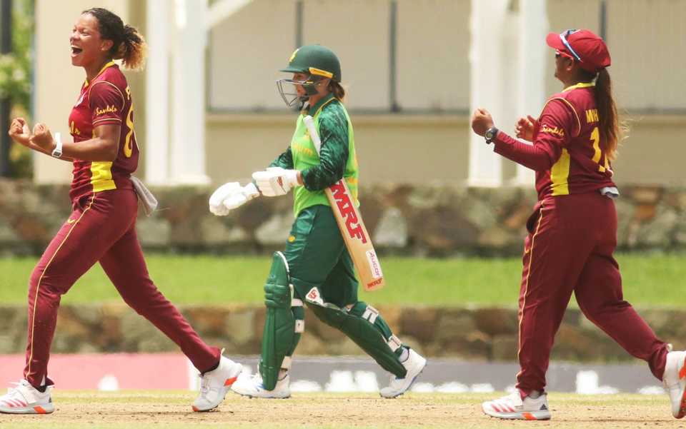 Cherry-Ann Fraser (L) celebrates her maiden ODI wicket, of Dane van Niekerk, as Mignon du Preez walks while Anisa Mohammed (R) rejoices, 4th ODI, Antigua, September 16, 2021