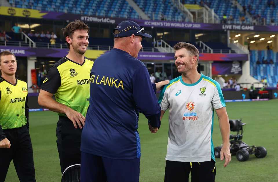 Sri Lanka head coach Mickey Arthur greets David Warner after Australia beat Sri Lanka, as Mitchell Marsh looks on, Australia vs Sri Lanka, 2021 Men's T20 World Cup, Dubai, October 28, 2021