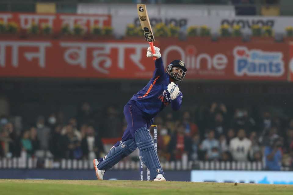 Rishabh Pant's bottom hand loses contact with the bat as he launches a six