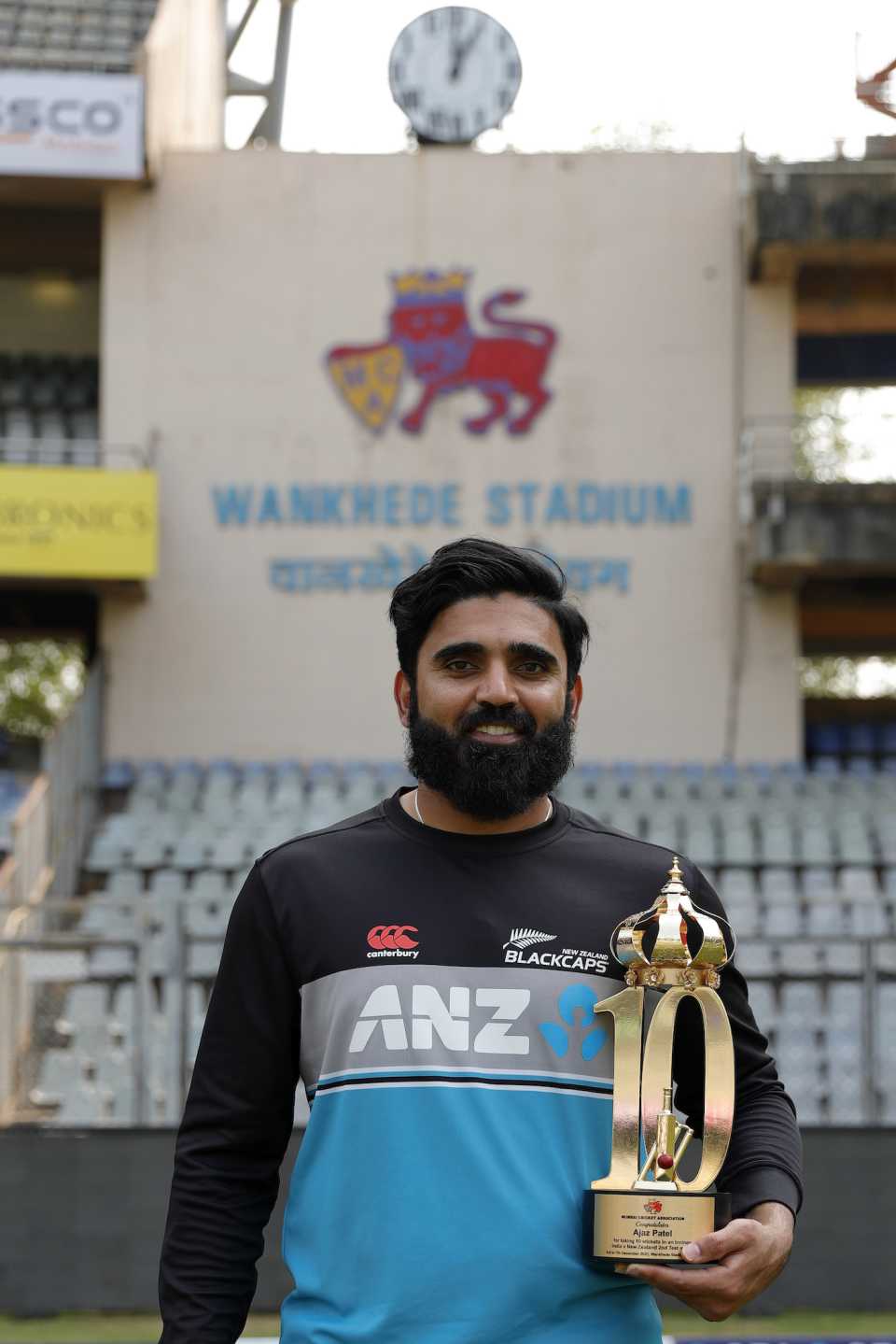 Ajaz Patel poses with his special trophy, awarded for achieving the Perfect Ten