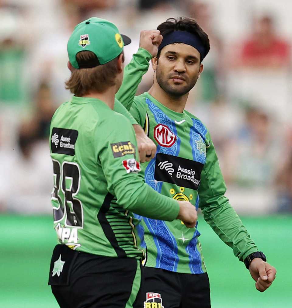 Qais Ahmad and Adam Zampa celebrate after the fall of a wicket, Melbourne Stars vs Adelaide Strikers, BBL 2021-22, Melbourne, January 10, 2022