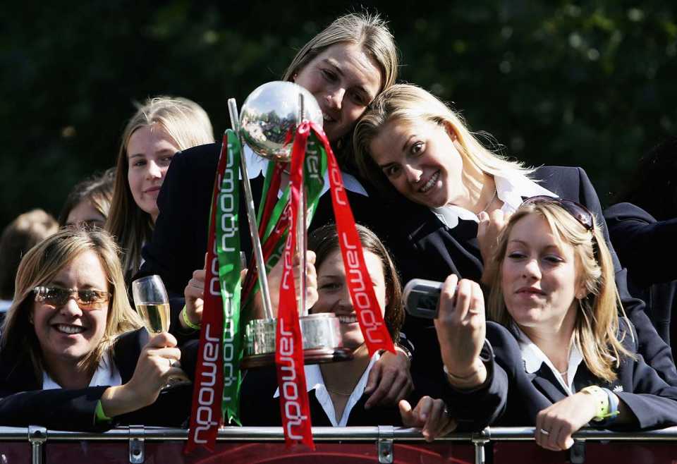 Player of the Series Katherine Brunt (second from right) makes a face while taking photos with her team-mates during the victory parade at Trafalgar Square, London, September 13, 2005