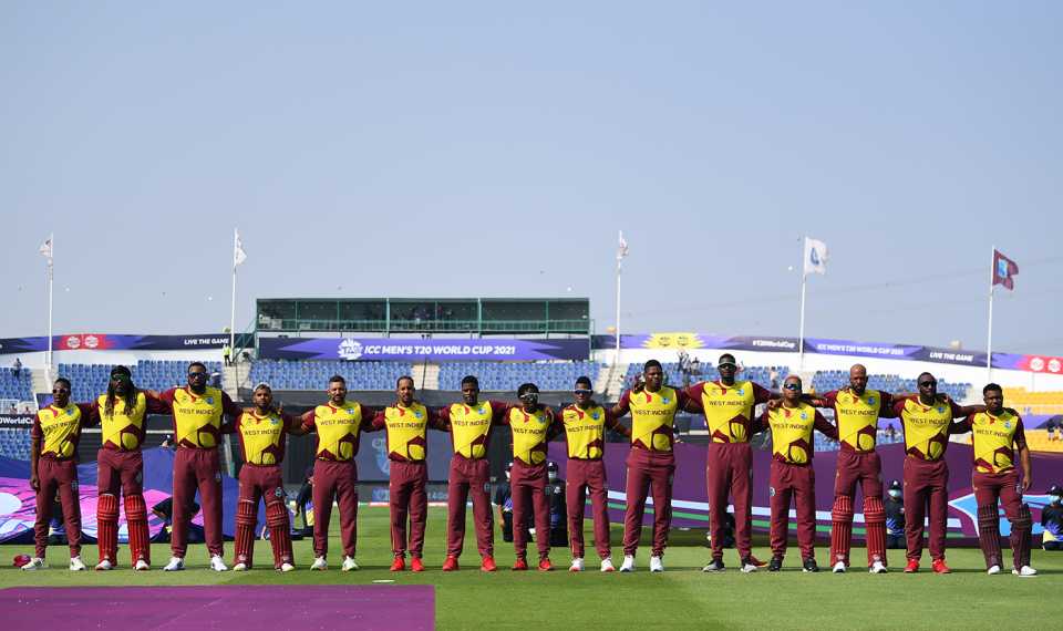 West Indies players line up for the anthems
