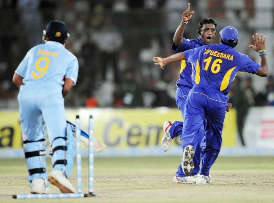 Ajantha Mendis celebrates the wicket of RP Singh