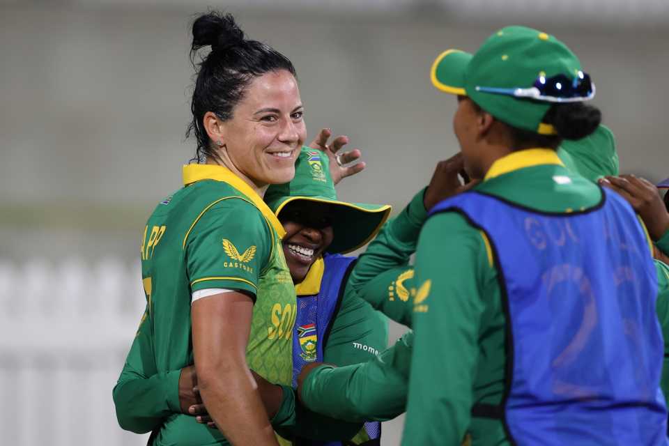 A relieved Marizanne Kapp is congratulated by her team-mates after the win, England vs South Africa, Women's World Cup 2022, Mount Maunganui, March 14, 2022
